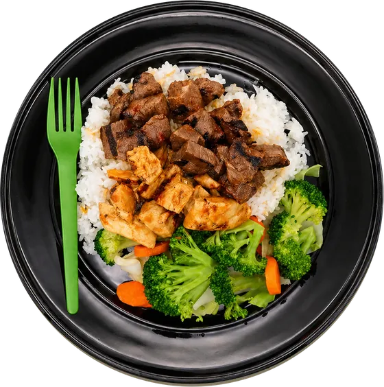 Fresh Fork Grill bowl with grilled steak and chicken over white rice with broccoli and carrots